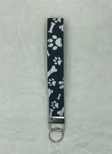 Load image into Gallery viewer, Black Paw and Bone Print Boho Wristlet Keychain/Key Fob holder