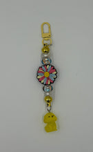 Load image into Gallery viewer, Pink and blue daisy Charm with glow in the dark dog